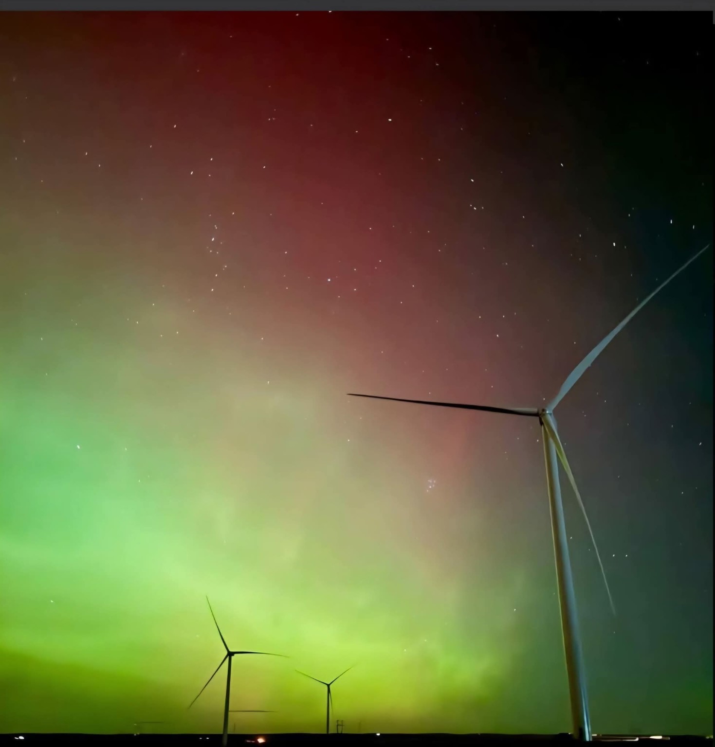 Turbines beneath the night sky