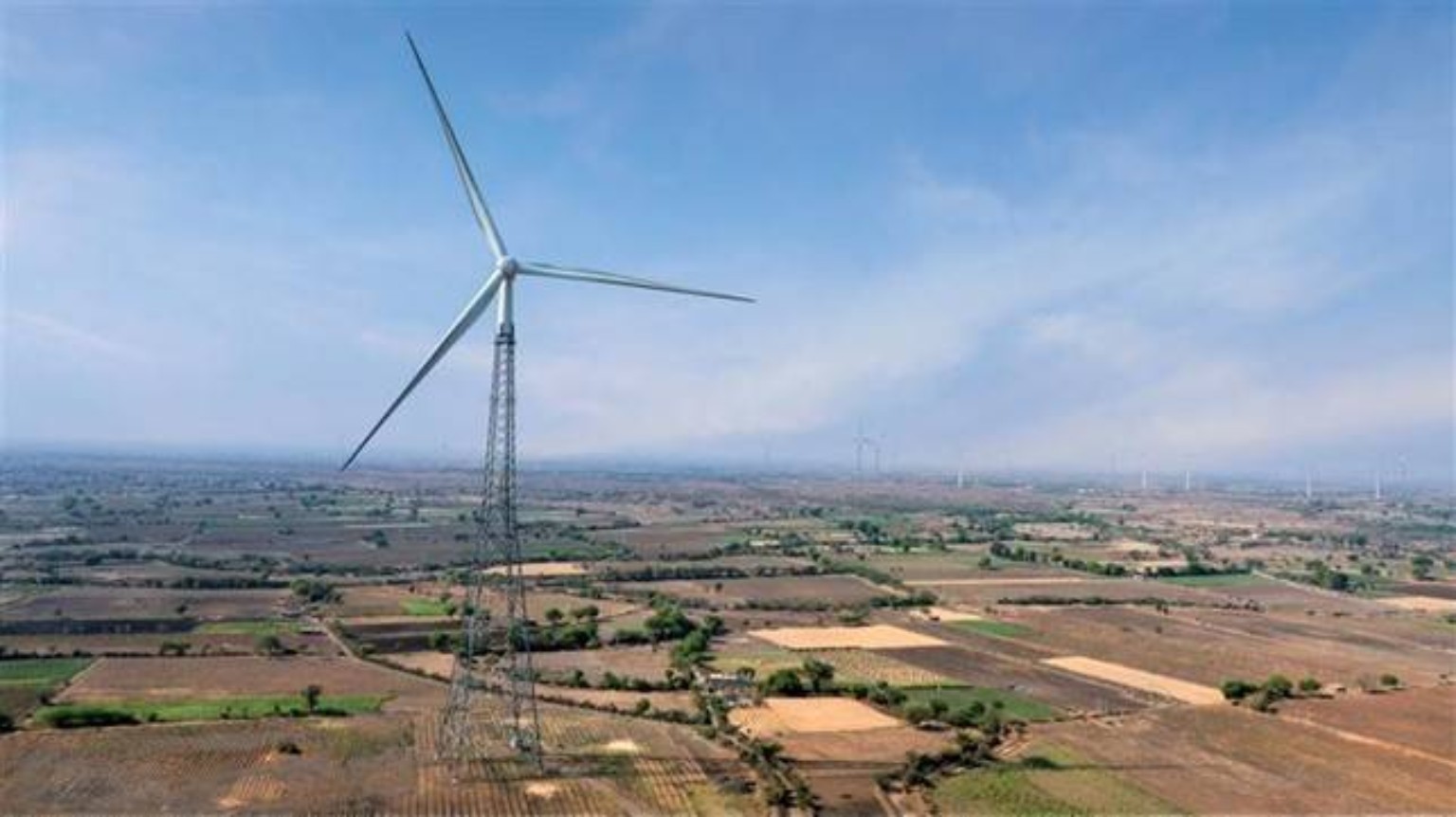 Lattice turbine above agricultural land
