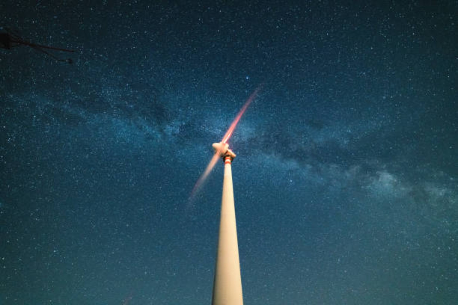 Turbine beneath a starry night sky